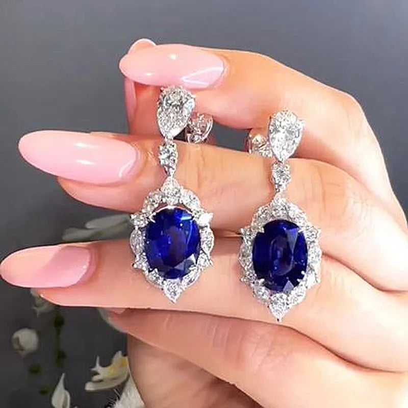 Luxurious Halo Oval Cut Blue Sapphire Women's Earrings In Sterling Silver